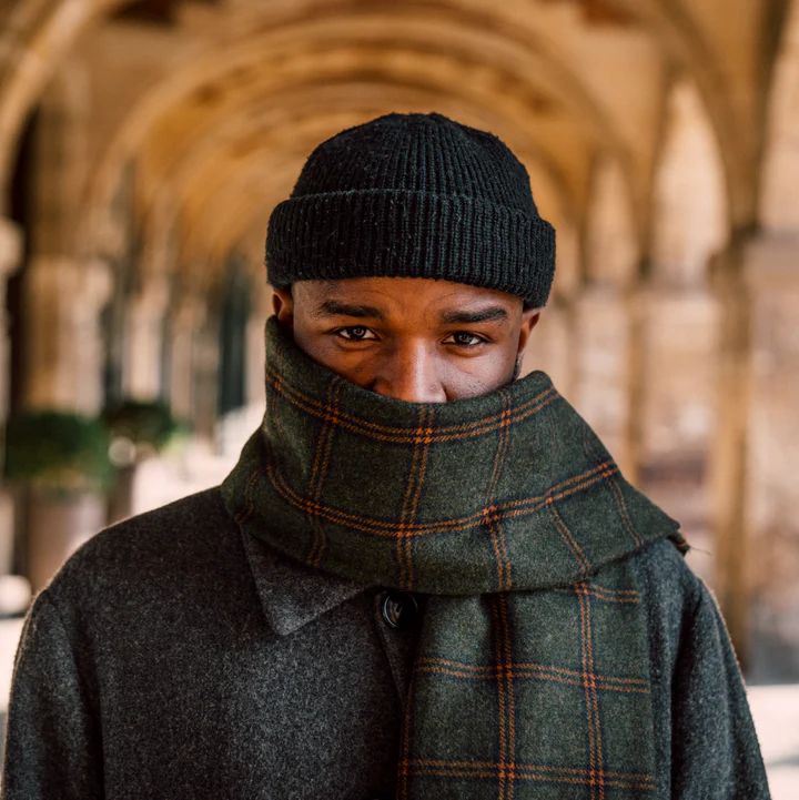 Model wearing winter scarf and black toque
