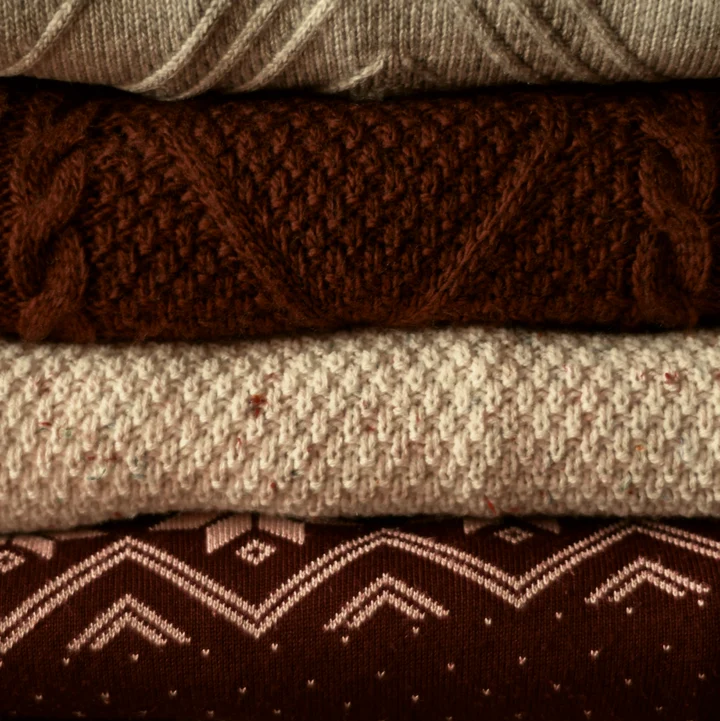 Stack of folded textured sweaters